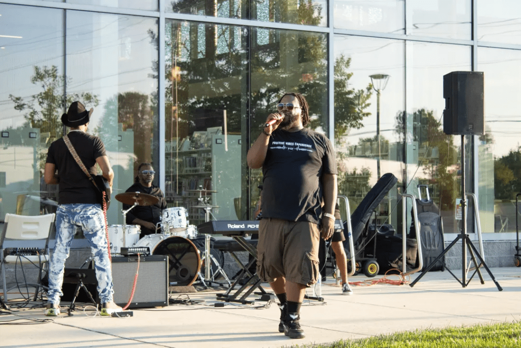 Haneef Salaam, center, organizing music and art events at the United Artists Exchange in Wilmington in 2024.. | SPOTLIGHT DELAWARE PHOTO BY BRIANNA HILL