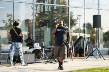 Haneef Salaam, center, organizing music and art events at the United Artists Exchange in Wilmington in 2024.. | SPOTLIGHT DELAWARE PHOTO BY BRIANNA HILL